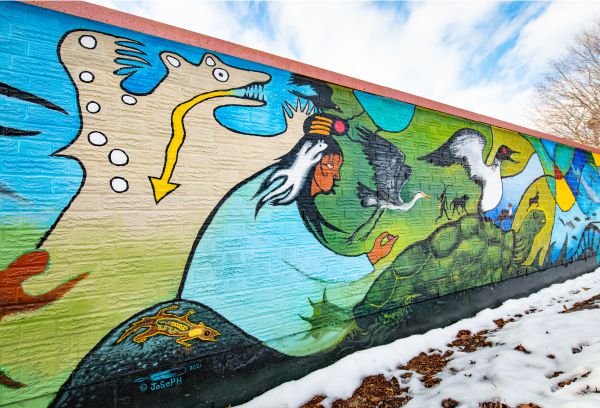 Mural showing native imagery of animals and land