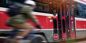 Image of bike rider and streetcar