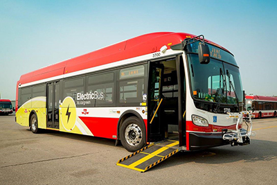 Electric bus with ramp extended