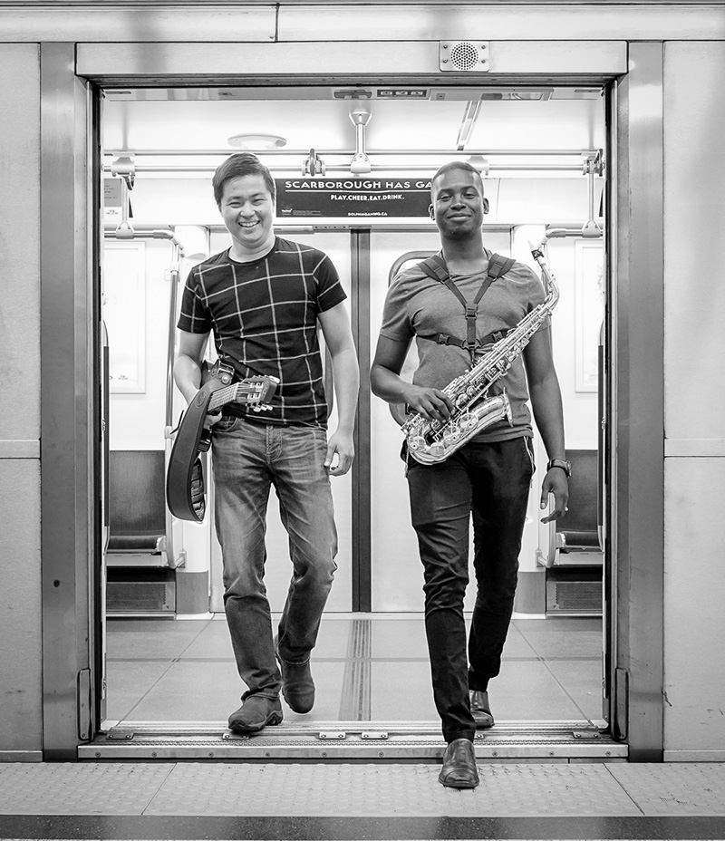 Subway musicians Kevin and Martin exiting a subway.