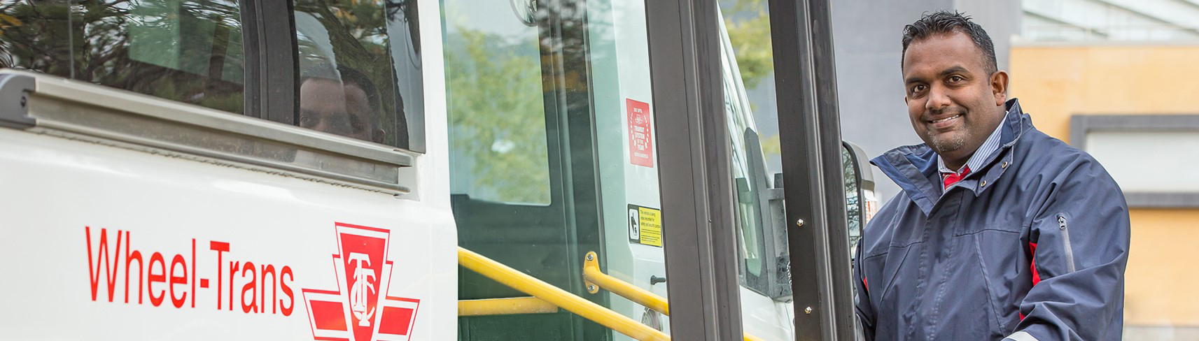 TTC Driver in front of Wheel-Trans Bus