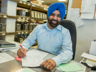 Man sitting at desk doing paperwork