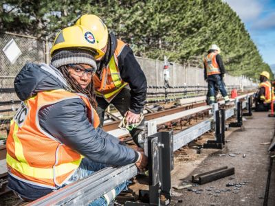 Workers repair subway rail
