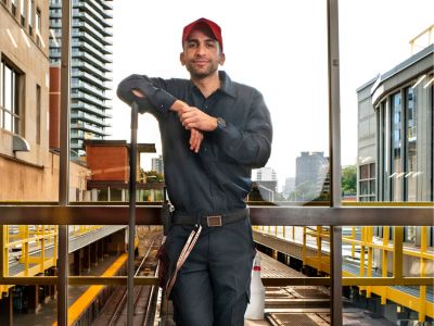 Subway janitor in front of a station window