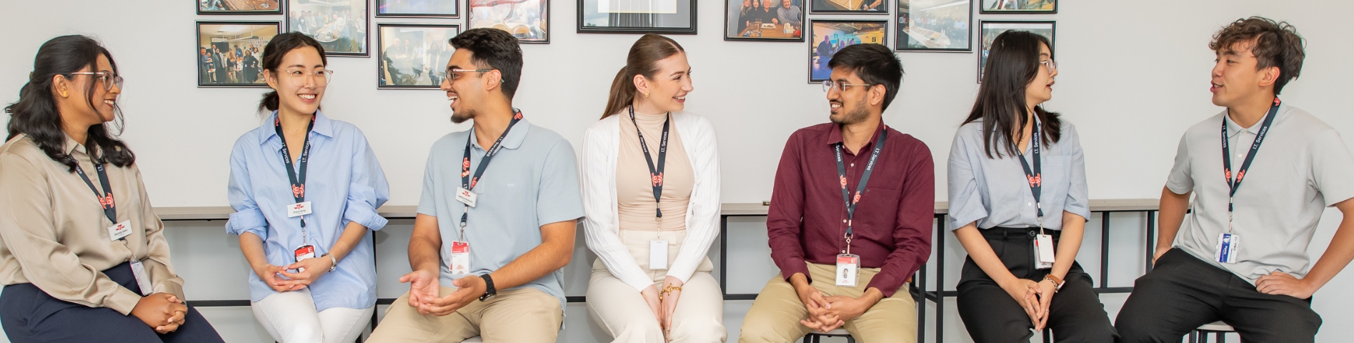 Six people sitting and having a conversation