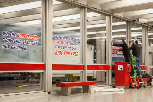 Honest Ed's signs in the concourse at Bathurst Station