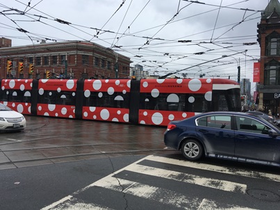 Red streetcar with white polka-dots