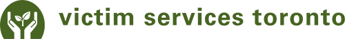 Victim services Toronto logo. Two hands cupping around a leaf shown on a green circular backgroud.