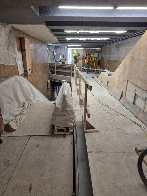 Photo 1: Phase 1 (Elevator 2) elevator shaft and accessible walkway under construction inside the Station for the southbound platform