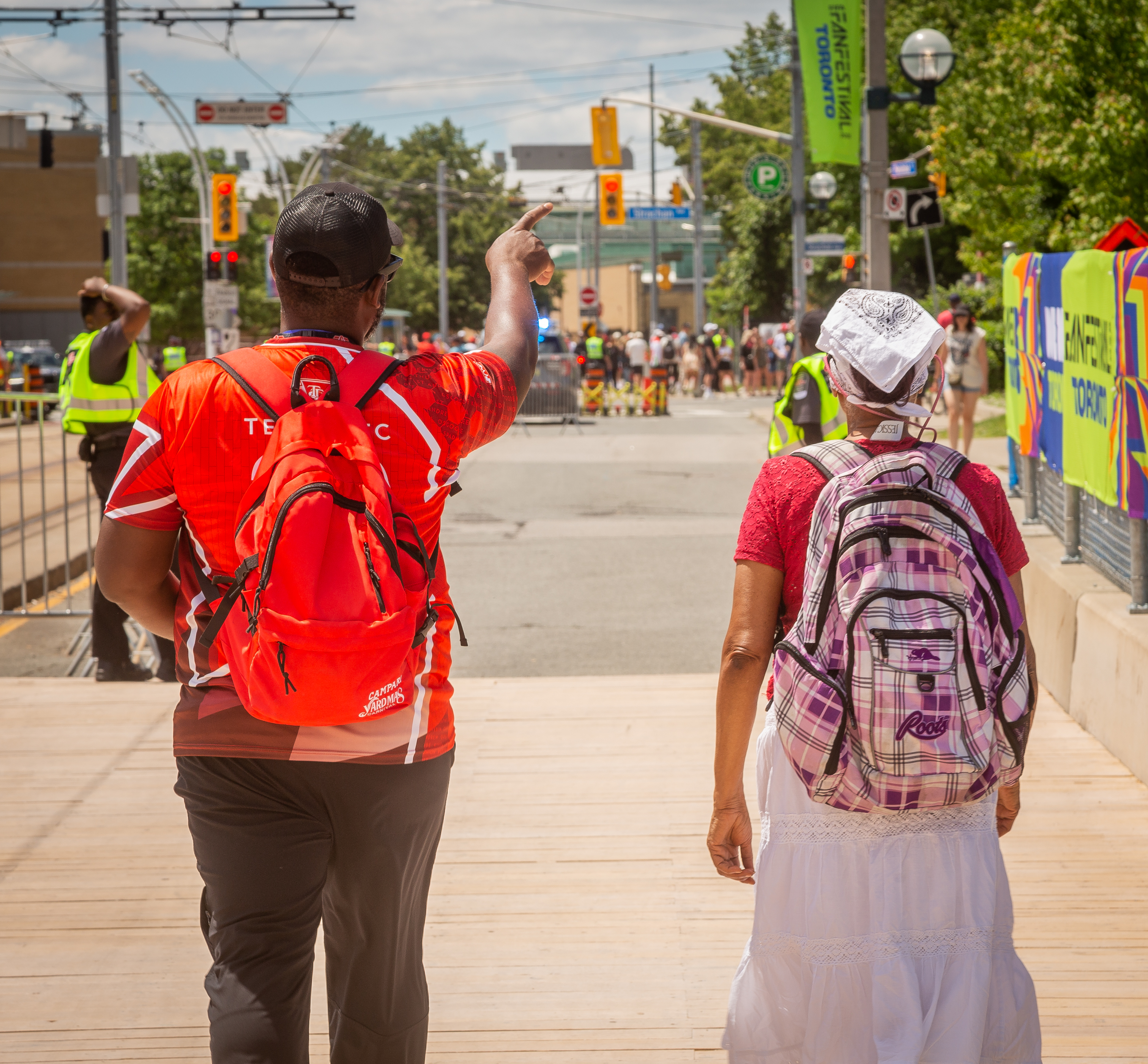 TTC ambassadorhelping direct a customer to their destination. 