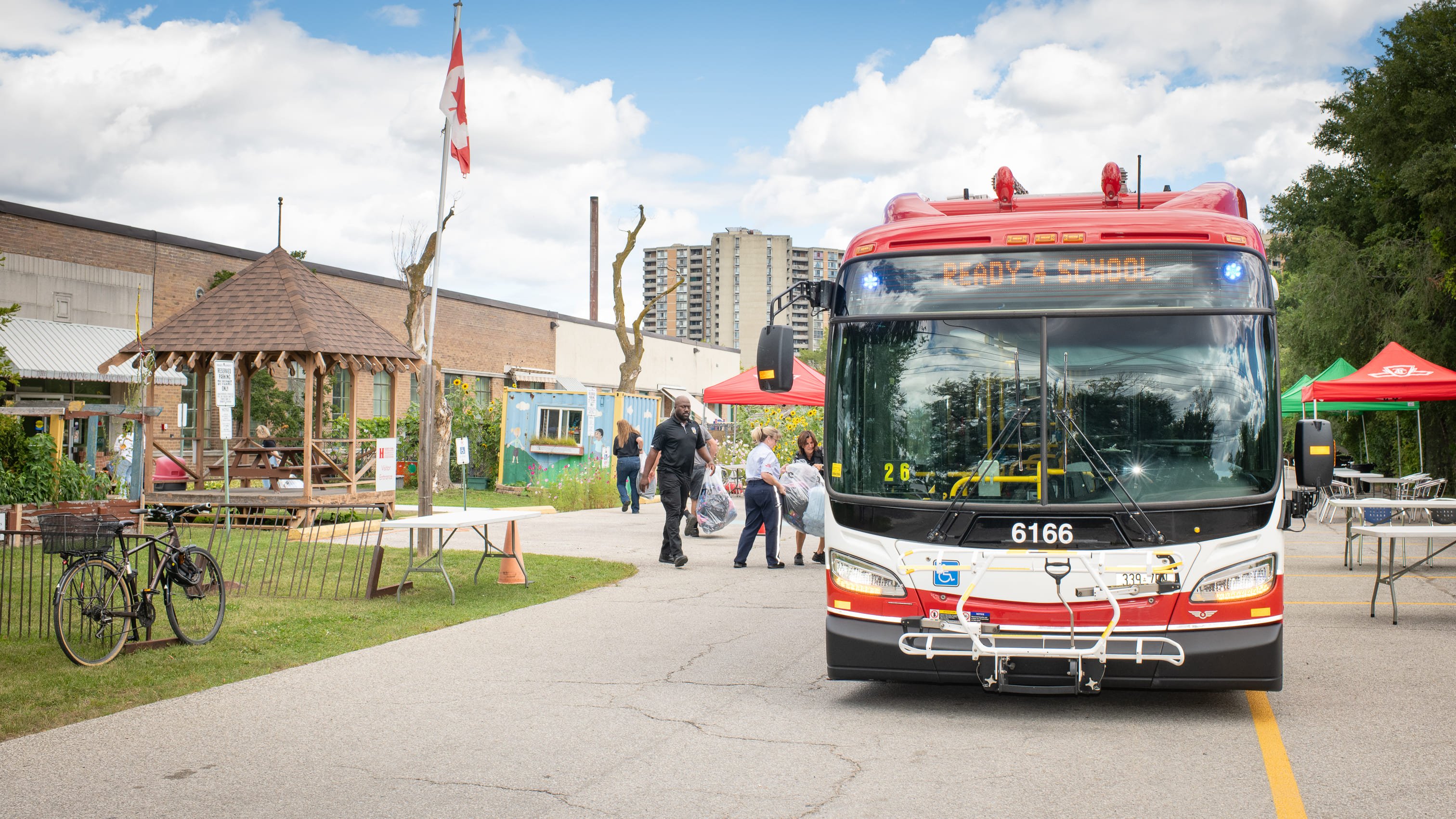 TTC bus displaying ‘Ready 4 School’ parked at a Backpack Drive collection event