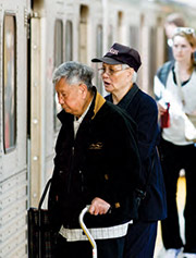Customers board a subway.