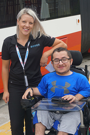 Daniel Waldman and Desrianne McIllwrick posing in front of a streetcar