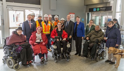 Members of ACAT join TTC employees, TTC Chair Josh Colle and Councillor Janet Davis to officially open the new elevator at Coxwell Station. 