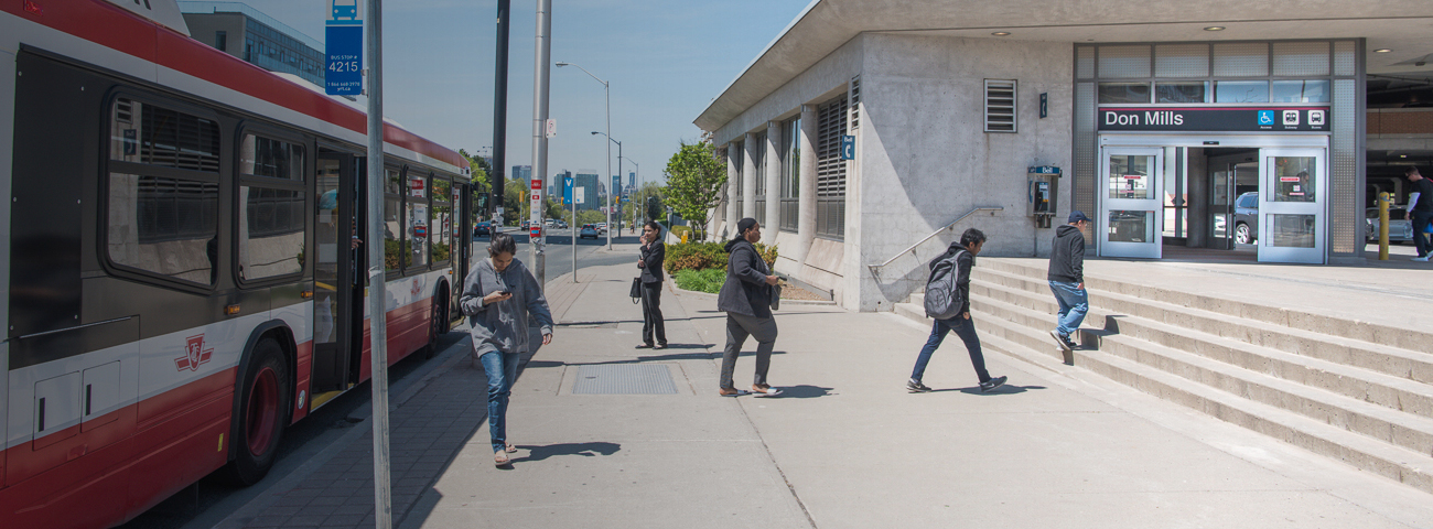 Passengers unboarding from Bus and walking toward Don Mills Station Entrance